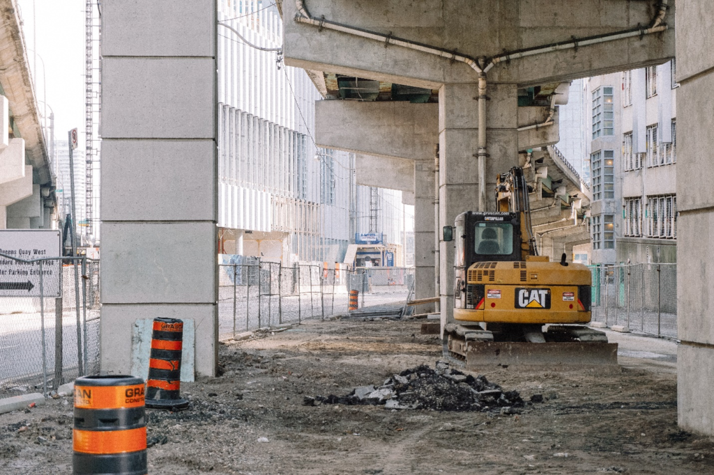  A CAT excavator under a bridge