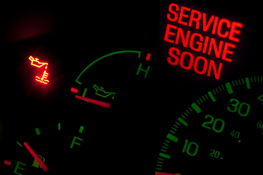 The check engine light glowing in a car.