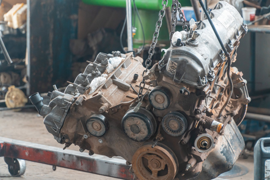 A car engine being lifted 