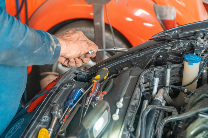  A mechanic repairing a vehicle 