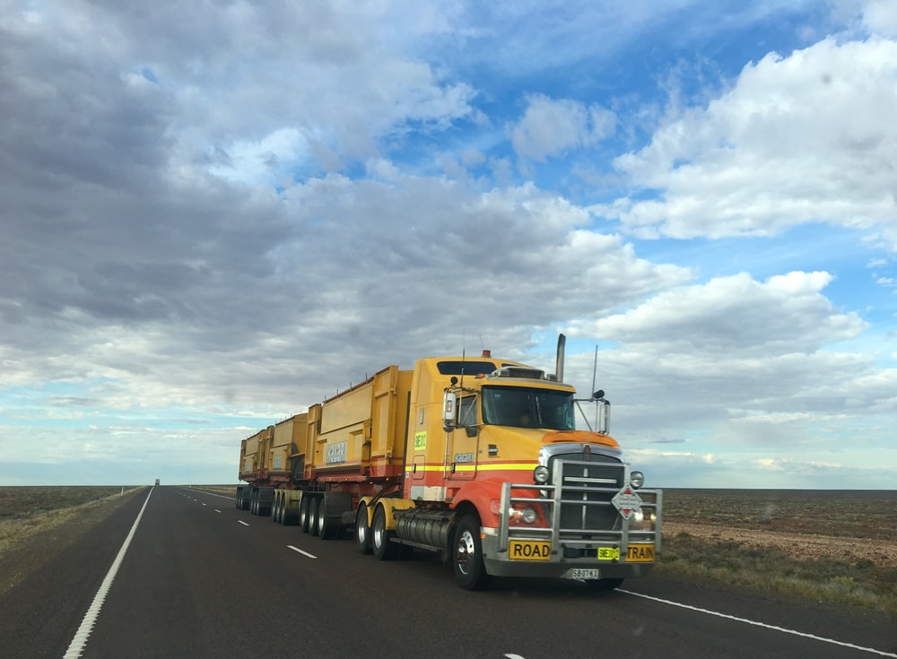 A yellow truck on a road