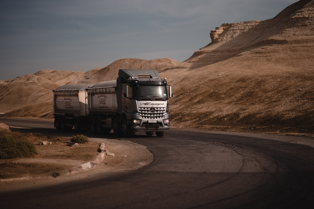  a grey truck on the road 