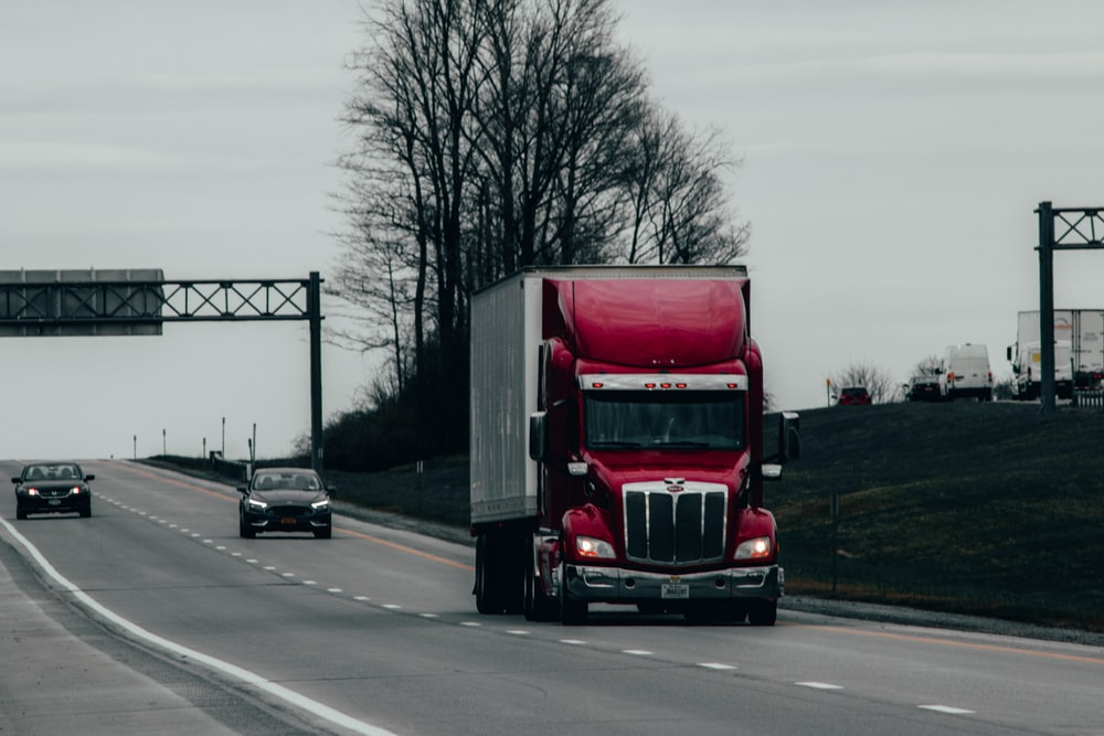 a red truck on the road 