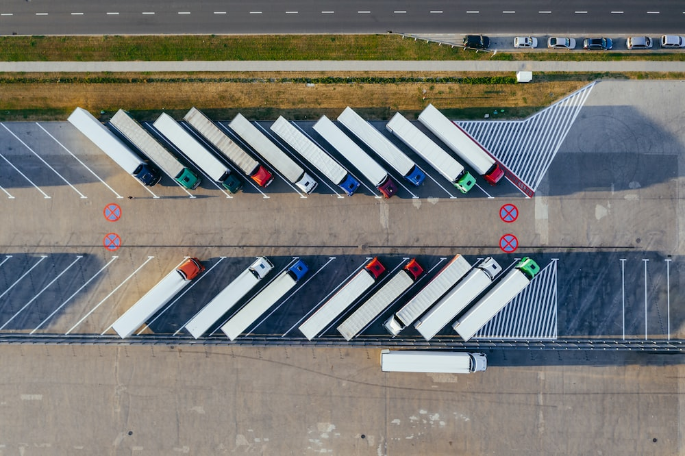 Bird’s-eye view of a fleet of parked trucks.